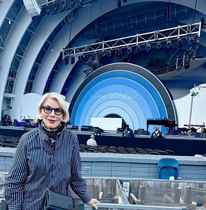 michelle standing in amphitheater for joni mitchell concert