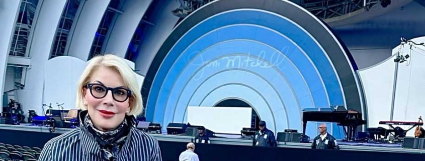 michelle standing in amphitheater for joni mitchell concert